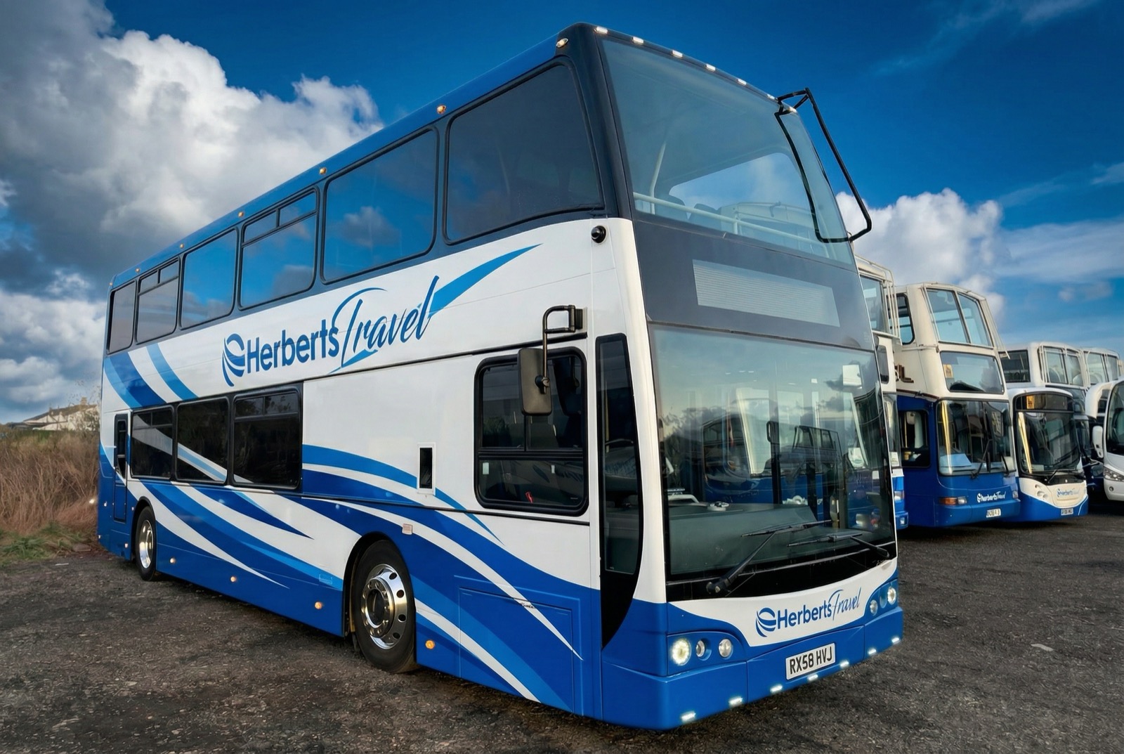Herberts Travel double-deckers parked in a row in cobalt and white livery